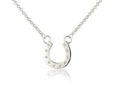 A sterling silver horseshoe necklace with sparkly cubic zirconia stones on a silver chain, displayed against a white background.